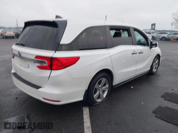 2020 Honda Odyssey EX-L with VIN 5FNRL6H78LB031411, listed as a IAAI auction lot 41027726 with 55,586 mi miles. Bid and sale history available at carsss.com. Image 4.