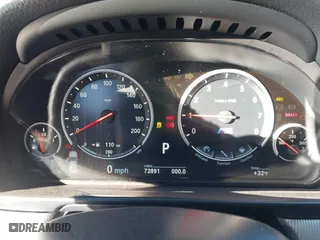 2014 BMW M5 with VIN WBSFV9C50ED097488, listed as a IAAI auction lot 41185321 with 72,891 mi miles. Bid and sale history available at carsss.com. Image 7.
