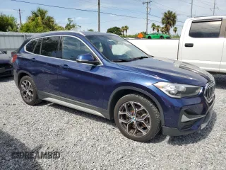 2020 BMW X1 xDrive28i with VIN WBXJG9C0XL5R33141, listed as a Copart auction lot 63040155 with 165,172 mi miles and Clean title. Bid and sale history available at DreamBid. Image 4.