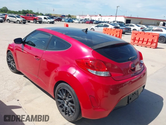 2013 Hyundai Veloster w/Black Int with VIN KMHTC6AD9DU135318, listed as a IAAI auction lot 42632212 with 97,485 mi miles and . Bid and sale history available at DreamBid. Image 3.