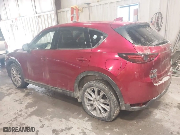 2021 Mazda CX-5 Grand Touring with VIN JM3KFBDMXM1430321, listed as a IAAI auction lot 41622134 with 44,955 mi miles. Bid and sale history available at carsss.com. Image 3.