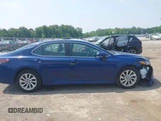 2023 Toyota Camry LE z VIN 4T1R11AK9PU180068, wystawiony jako IAAI lot #42483656 z przebiegiem 59 312 mil mil oraz . Historia ofert i sprzedaży dostępna na DreamBid. Obrazek 13.
