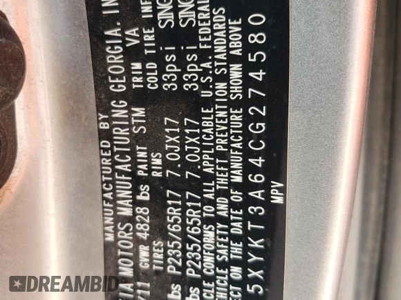 2012 Kia Sorento LX z VIN 5XYKT3A64CG274580, wystawiony jako Copart lot #55513455 z przebiegiem 167 369 mil mil oraz Szkoda całkowita • Salvage title. Historia ofert i sprzedaży dostępna na DreamBid. Obrazek 13.
