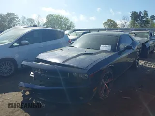 2013 Dodge Challenger SXT z VIN 2C3CDYAG2DH587643, wystawiony jako IAAI lot #41964792 z przebiegiem 179 791 mil mil oraz . Historia ofert i sprzedaży dostępna na DreamBid. Obrazek 17.