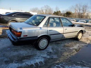 1990 Toyota Camry z VIN 4T1VV21EXLU008760, wystawiony jako Copart lot #88344665 z przebiegiem 154 971 mil mil oraz Nie do naprawy • Non repairable. Historia ofert i sprzedaży dostępna na DreamBid. Obrazek 3.