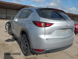 2018 Mazda CX-5 Grand Touring with VIN JM3KFADM6J0325626, listed as a IAAI auction lot 42054702 with 121,952 mi miles and . Bid and sale history available at DreamBid. Image 3.