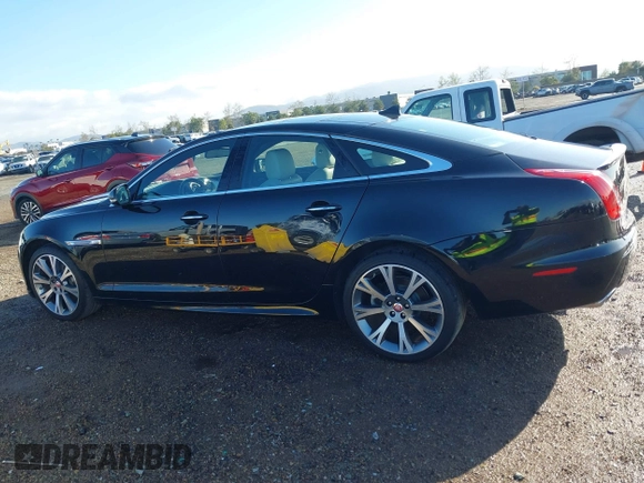 2015 Jaguar XJ with VIN SAJWA1CZ2F8V84677, listed as a IAAI auction lot 41723372 with 52,888 mi miles. Bid and sale history available at carsss.com. Image 14.