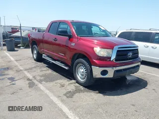 2010 Toyota Tundra with VIN 5TFUY5F18AX126316, listed as a IAAI auction lot 42499239 with 125,233 mi miles and . Bid and sale history available at DreamBid. Image 1.