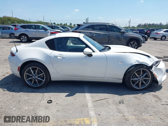 2021 Mazda MX-5 Miata Grand Touring z VIN JM1NDAM75M0450871, wystawiony jako IAAI lot #42060495 z przebiegiem 48 670 mil mil oraz . Historia ofert i sprzedaży dostępna na DreamBid. Obrazek 13.