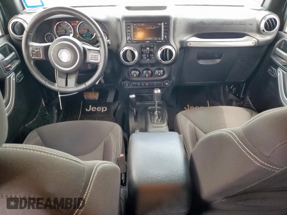 2015 Jeep Wrangler Unlimited Sahara with VIN 1C4BJWEG4FL668339, listed as a Copart auction lot 61221325 with 117,887 mi miles and Salvage title. Bid and sale history available at DreamBid. Image 8.