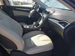 2016 Ford Fusion Titanium Hybrid with VIN 3FA6P0RU8GR127140, listed as a IAAI auction lot 41750405 with 110,861 mi miles. Bid and sale history available at carsss.com. Image 5.