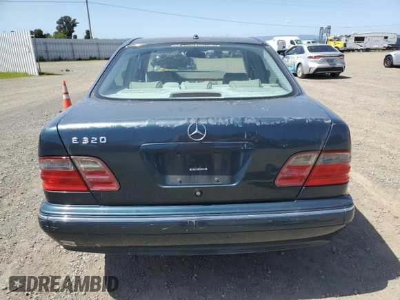 2000 Mercedes-Benz E-Class with VIN WDBJF65J1YB151080, listed as a Copart auction lot 54421955 with 392,612 mi miles and Salvage Title. Bid and sale history available at carsss.com. Image 6.