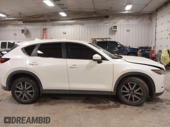 2018 Mazda CX-5 S Premium with VIN JM3KFBDM1J1412088, listed as a IAAI auction lot 41497431 with 65,532 mi miles and . Bid and sale history available at DreamBid. Image 13.
