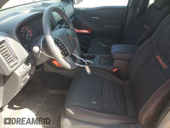 2023 Nissan Frontier Pro-4X with VIN 1N6ED1EK0PN668109, listed as a Copart auction lot 57064975 with 6,406 mi miles and Salvage title. Bid and sale history available at DreamBid. Image 7.