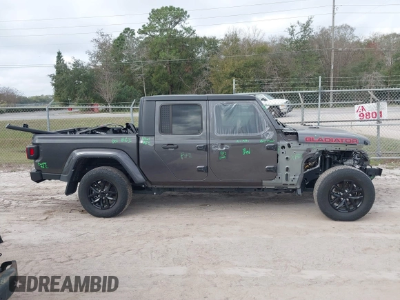 2022 Jeep Gladiator Texas Trail z VIN 1C6HJTAG0NL162804, wystawiony jako IAAI lot #41524087 z przebiegiem 17 652 mil mil oraz . Historia ofert i sprzedaży dostępna na DreamBid. Obrazek 14.