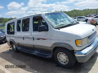 1999 Ford Econoline Cargo Recreational with VIN 1FDRE14L2XHA41059, listed as a IAAI auction lot 42067879 with 149,185 mi miles. Bid and sale history available at carsss.com. Image 13.