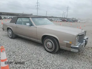 1985 Cadillac Eldorado z VIN 1G6EL5788FE655155, wystawiony jako Copart lot #73223134 z przebiegiem 68 676 mil mil oraz Tytuł czysty. Historia ofert i sprzedaży dostępna na DreamBid. Obrazek 4.