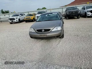 2002 Mercury Sable GS z VIN 1MEFM50U02G652804, wystawiony jako Copart lot #57405035 z przebiegiem 264 042 mil mil oraz Szkody całkowita. Historia ofert i sprzedaży dostępna na DreamBid. Obrazek 13.