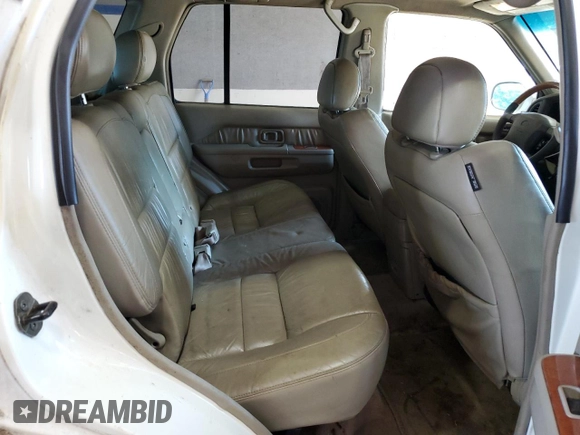 2001 Infiniti QX4 Luxury z VIN JNRDR09Y81W219674, wystawiony jako Copart lot #74221844 z przebiegiem 167 787 mil mil oraz Szkody całkowita. Historia ofert i sprzedaży dostępna na DreamBid. Obrazek 11.