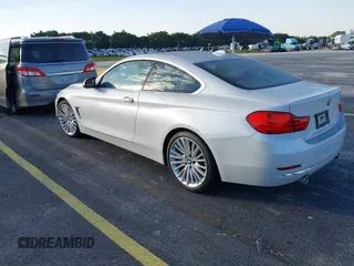 2014 BMW 4 Series 435i with VIN WBA3R1C51EK192795, listed as a IAAI auction lot 41263037 with 22,937 mi miles and . Bid and sale history available at DreamBid. Image 3.