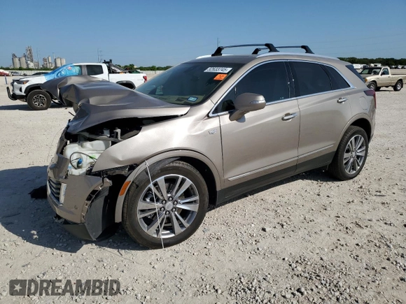 2022 Cadillac XT5 Premium Luxury AWD with VIN 1GYKNERS9NZ120517, listed as a Copart auction lot 52633745 with 31,456 mi miles and Salvage Title. Bid and sale history available at carsss.com. Image 1.
