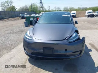 2022 Tesla Model Y Long Range with VIN 7SAYGDEE3NA007737, listed as a IAAI auction lot 42128359 with 42,597 mi miles and . Bid and sale history available at carsss.com. Image 13.