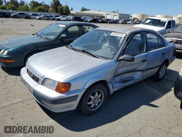 1995 Toyota Tercel DX z VIN JT2EL56E7S7011335, wystawiony jako Copart lot #67978774 z przebiegiem 182 025 mil mil oraz Szkoda całkowita • Salvage title. Historia ofert i sprzedaży dostępna na DreamBid. Obrazek 1.