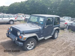 2001 Jeep Wrangler Sport with VIN 1J4FA49S91P330175, listed as a IAAI auction lot 40133432 with 999,999 mi miles. Bid and sale history available at carsss.com. Image 2.