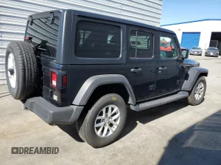 2023 Jeep Wrangler Sport with VIN 1C4HJXDNXPW701795, listed as a Copart auction lot 50451444 with 7,274 mi miles and Salvage Title. Bid and sale history available at DreamBid. Image 3.
