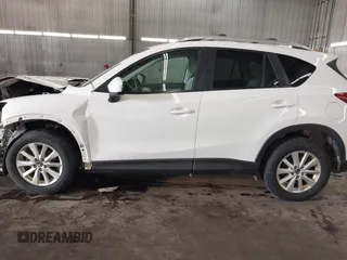 2014 Mazda CX-5 Touring with VIN JM3KE4CY4E0321055, listed as a IAAI auction lot 41613593 with 174,339 mi miles. Bid and sale history available at carsss.com. Image 15.