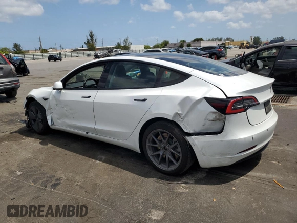 2021 Tesla Model 3 Standard Range Plus with VIN 5YJ3E1EA2MF854713, listed as a Copart auction lot 53783535 with 84,585 mi miles and Non Repairable. Bid and sale history available at DreamBid. Image 2.