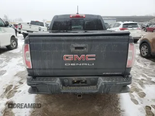 2021 GMC Canyon 4WD Denali with VIN 1GTG6EENXM1199427, listed as a Copart auction lot 86018624 with 98,520 mi miles and Salvage Title. Bid and sale history available at carsss.com. Image 6.