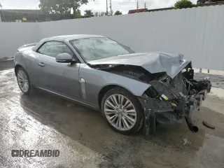 2010 Jaguar XK with VIN SAJWA4GB4ALB37114, listed as a Copart auction lot 77673824 with 99,999 mi miles and Salvage Title. Bid and sale history available at carsss.com. Image 4.