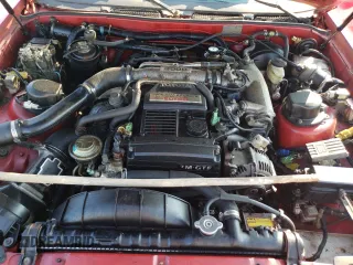 1988 Toyota Supra z VIN JT2MA71JXJ0094266, wystawiony jako Copart lot #59028715 z przebiegiem 133 654 mil mil oraz Czysty tytuł • Clean title. Historia ofert i sprzedaży dostępna na DreamBid. Obrazek 11.