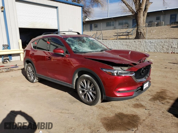2020 Mazda CX-5 Grand Touring with VIN JM3KFBDM9L1820907, listed as a Copart auction lot 86166054 with 34,007 mi miles and Salvage Title. Bid and sale history available at carsss.com. Image 4.