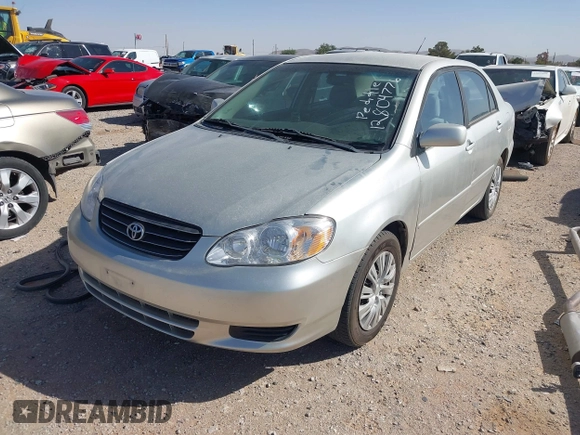 2004 Toyota Corolla CE with VIN 1NXBR32E64Z283247, listed as a IAAI auction lot 42121254 with 292,754 mi miles. Bid and sale history available at carsss.com. Image 2.