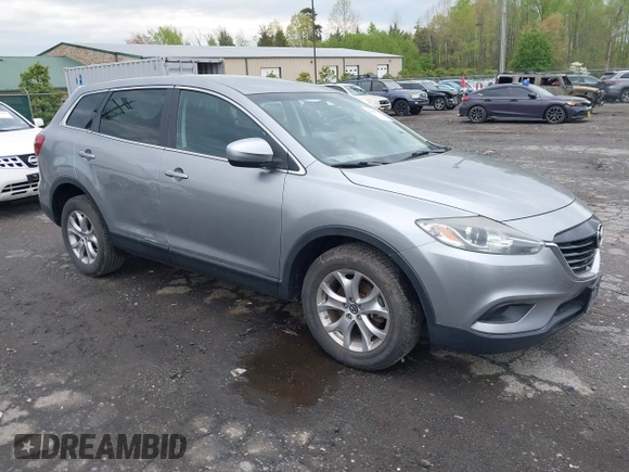 2015 Mazda CX-9 Sport with VIN JM3TB3BV2F0454770, listed as a IAAI auction lot 42009879 with 98,916 mi miles and . Bid and sale history available at carsss.com. Image 1.
