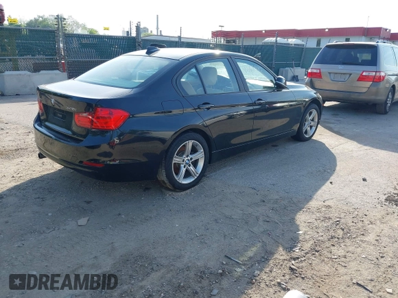 2014 BMW 3 Series 328i xDrive with VIN WBA3B5G56ENS06890, listed as a IAAI auction lot 42168982 with 133,664 mi miles. Bid and sale history available at carsss.com. Image 4.