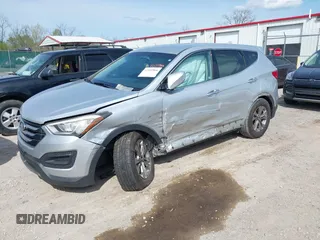 2016 Hyundai Santa Fe z VIN 5XYZTDLB0GG338313, wystawiony jako IAAI lot #42103866 z przebiegiem 111 555 mil mil oraz . Historia ofert i sprzedaży dostępna na DreamBid. Obrazek 2.