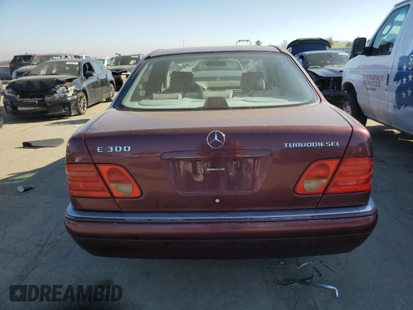 1998 Mercedes-Benz E 320 with VIN WDBJF25FXWA549962, listed as a Copart auction lot 87876005 with 303,884 mi miles and Salvage Title. Bid and sale history available at DreamBid. Image 6.