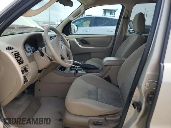 2005 Ford Escape XLT with VIN 1FMYU03165KC03784, listed as a Copart auction lot 64299225 with 185,033 mi miles and Salvage title. Bid and sale history available at DreamBid. Image 7.