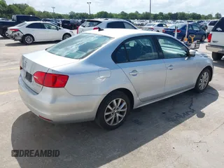 2012 Volkswagen Jetta Sedan SE w/Convenience with VIN 3VWDX7AJ1CM401939, listed as a IAAI auction lot 41941070 with 123,611 mi miles. Bid and sale history available at carsss.com. Image 4.