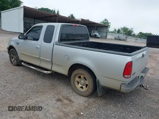 2000 Ford F-150 XL with VIN 1FTZX1725YNC17400, listed as a IAAI auction lot 42031955 with 1 mi miles. Bid and sale history available at carsss.com. Image 3.