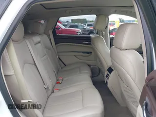 2016 Cadillac SRX Luxury Collection z VIN 3GYFNBE33GS507014, wystawiony jako IAAI lot #41979980 z przebiegiem 115 077 mil mil oraz . Historia ofert i sprzedaży dostępna na DreamBid. Obrazek 8.