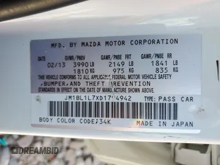 2013 Mazda 3 i Touring z VIN JM1BL1L7XD1794942, wystawiony jako Copart lot #57842295 z przebiegiem 124 408 mil mil oraz Szkoda całkowita • Salvage title. Historia ofert i sprzedaży dostępna na DreamBid. Obrazek 12.
