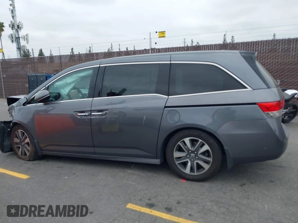 2014 Honda Odyssey Touring with VIN 5FNRL5H97EB114634, listed as a IAAI auction lot 42105220 with Not Provided miles and . Bid and sale history available at carsss.com. Image 13.