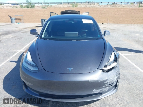 2019 Tesla Model 3 Mid Range with VIN 5YJ3E1EA6KF307456, listed as a IAAI auction lot 41944454 with 99,059 mi miles and . Bid and sale history available at DreamBid. Image 11.