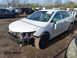 2014 Toyota Camry L with VIN 4T4BF1FK1ER424875, listed as a IAAI auction lot 42025877 with 113,919 mi miles. Bid and sale history available at carsss.com. Image 2.