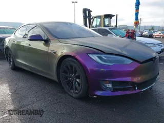 2016 Tesla Model S 90D with VIN 5YJSA1E29GF145121, listed as a IAAI auction lot 41777665 with 128,765 mi miles and . Bid and sale history available at DreamBid. Image 1.