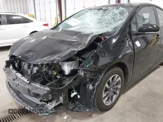 2022 Toyota Prius L Eco with VIN JTDKAMFU2N3186072, listed as a IAAI auction lot 42486252 with 5,887 mi miles and . Bid and sale history available at DreamBid. Image 6.